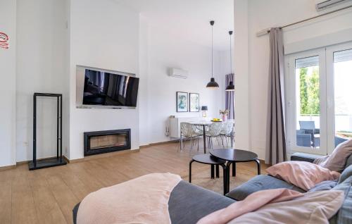 a living room with a couch and a fireplace at Villa Esperanza in Canillas de Albaida