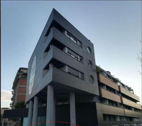 a tall building with many windows in front of it at Suite Panoramic Attico in Terni