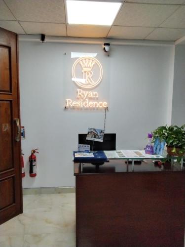 an office with a ryan residence sign on a wall at Ryan Residence & Restaurant in Negombo