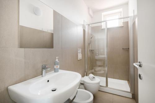 a bathroom with a sink and a toilet and a shower at Agriturismo Le Masciare in Paternopoli