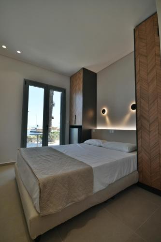 Okeanis Hotel Tyrosにあるベッド