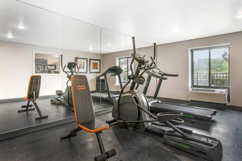 a gym with cardio machines and a mirror at MainStay Suites Little Rock West Near Medical Centers in Little Rock