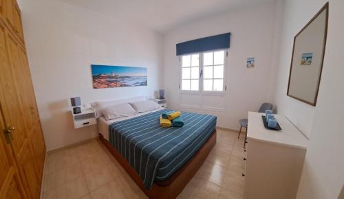 En eller flere senge i et værelse på Casa Fayna