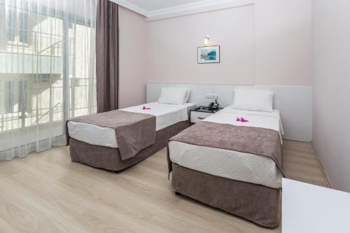 Katil atau katil-katil dalam bilik di Habesos Hotel