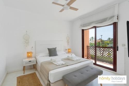 Ένα ή περισσότερα κρεβάτια σε δωμάτιο στο Homity Holidays - Playa Granada - Albatros