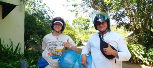 two men are wearing helmets and giving a thumbs up at Samudra Luxe Resort in Habarana