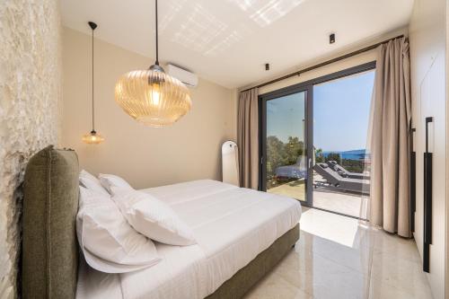 Ένα ή περισσότερα κρεβάτια σε δωμάτιο στο Aggelatos Stone Villas