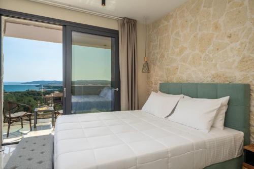Ένα ή περισσότερα κρεβάτια σε δωμάτιο στο Aggelatos Stone Villas