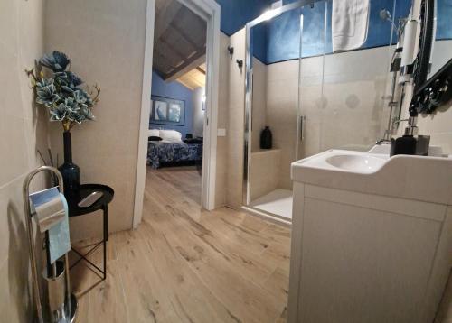 a bathroom with a sink and a shower at Dream Apartments alloggio turistico in Civitavecchia