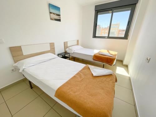 Posteľ alebo postele v izbe v ubytovaní Apartamentos Benicarló Lowcost 3000