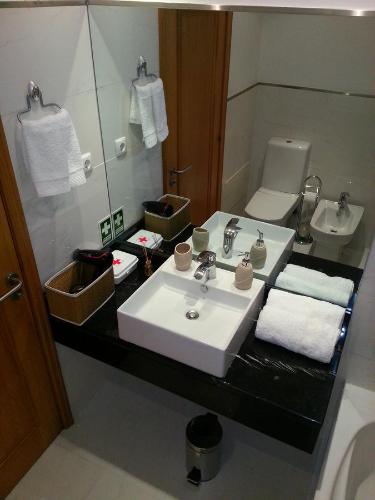 a bathroom with a sink and a toilet at Jardim das Madalenas in Funchal