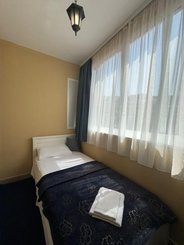 Cama o camas de una habitación en FOR-A Apartmani