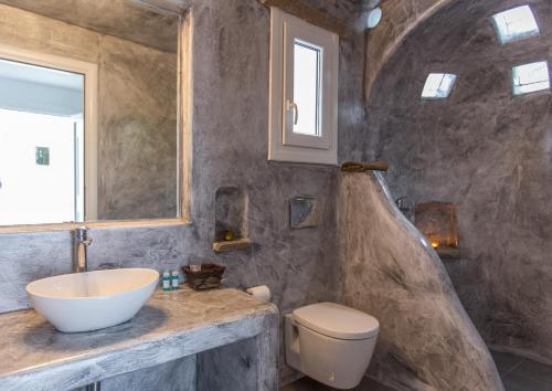 a bathroom with a sink and a toilet at Anais in Mýkonos City