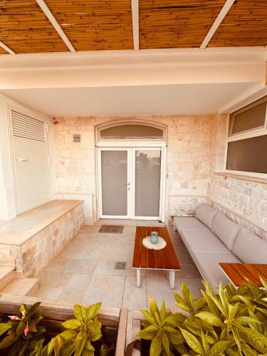 a living room with a couch and a table at Agape B&B Monopoli in Monopoli
