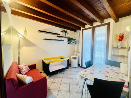 a living room with a couch and a table at New Apartment on Ground Floor with Terrace in Desenzano del Garda