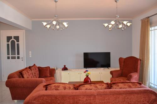 TV a/nebo společenská místnost v ubytování Aithrea's HOMES in Pastida Rhodes