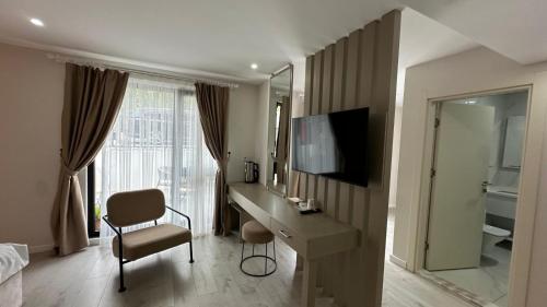 a hotel room with a desk and a mirror at THE DECK OTEL in Trabzon