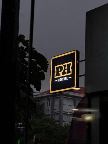 a rf hotel sign on the side of a building at PH Hotel Near SECC Phu My Hung in Ho Chi Minh City