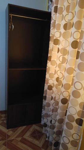 a bathroom with a shower with a shower curtain at Arum Qurpawasi Hospedaje in Cabanaconde