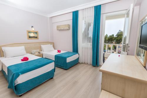 Katil atau katil-katil dalam bilik di Habesos Hotel