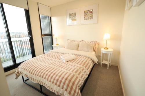 Ένα ή περισσότερα κρεβάτια σε δωμάτιο στο Tido Gallery Stay AT Swan