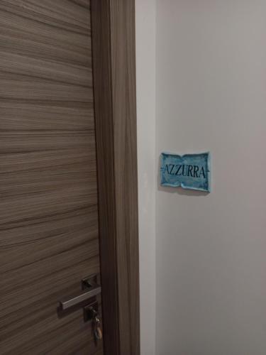 a door with a sign that says varma on it at B&B Lido Esperando in Sciacca