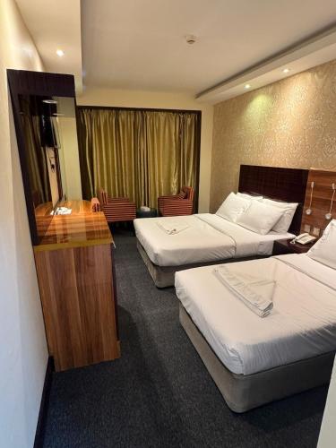Postel nebo postele na pokoji v ubytování Akasiya Hotel - Formerly known as Fal Hotel