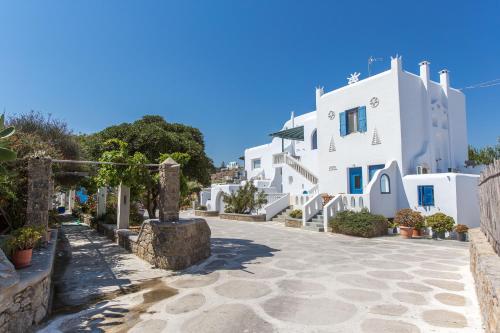 a street in a village with white buildings at Anais in Mýkonos City