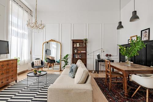 a living room with a couch and a table at Hidden gem in the very heart of the city in Budapest