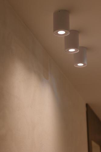 a row of lights on the ceiling of a room at Maison Sirolo in Sirolo