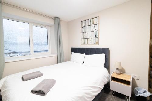 Ένα ή περισσότερα κρεβάτια σε δωμάτιο στο Malin View Apartments PORT71