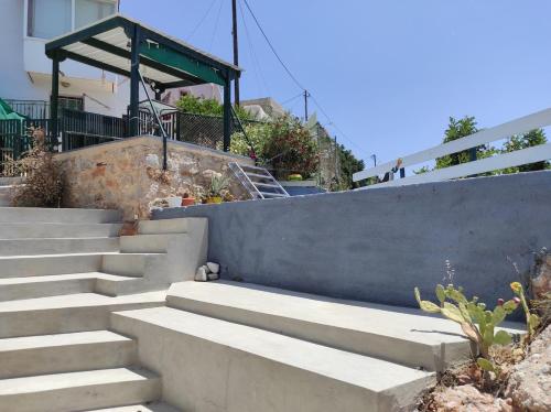 a set of stairs leading up to a house at Accommodation in Lithi in Chios