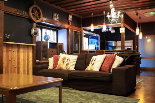 a living room with a couch and a table at WAVILLA mihata cho in Yamagata