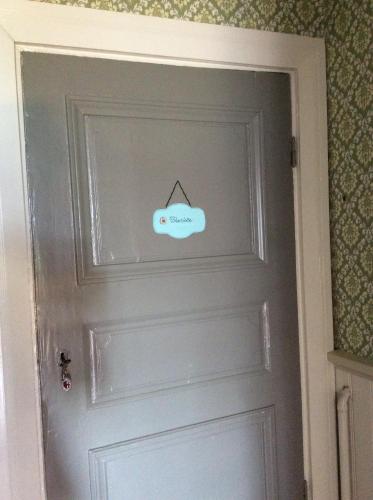 a closed door with a sign on it at Tiittalan Kartano in Sulkava