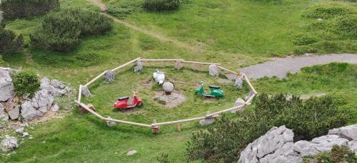 a model of a farm with toy horses in a field at Sonnleitn AlpinWell Appartment (Ski in&out + Wellness) in Hermagor