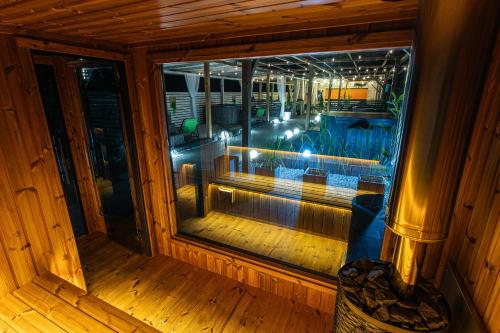 an inside view of a room with a window at Old Tree Home & Restaurant in Oświęcim