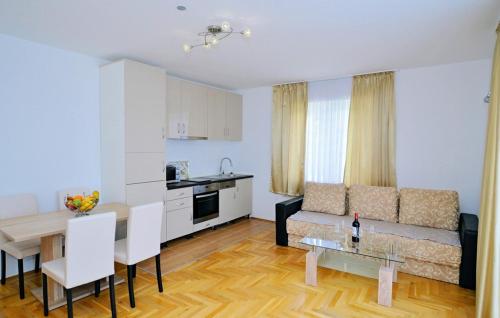 a living room with a couch and a table at Apartman Zora 3 by Villas guide in Mošćenice