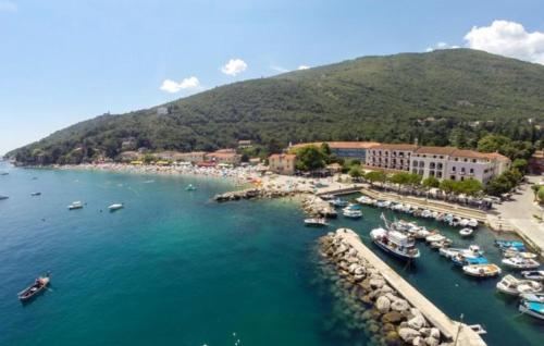 an aerial view of a harbor with boats in the water at Apartman Zora 3 by Villas guide in Mošćenice