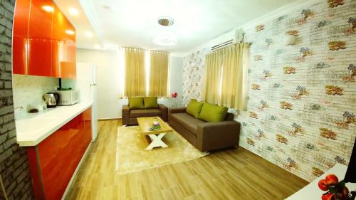 a living room with a couch and a table at City Apartments in Eilat