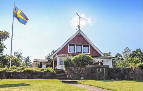 a house with a flag in front of it at Nice Home In Tranås With Kitchen in Tranås
