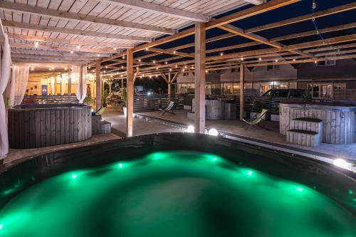 a swimming pool in the middle of a building at Old Tree Village & Restaurant in Oświęcim