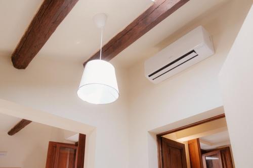 a ceiling with a white air conditioner in a room at Palazzo Lucangeli in Porto Recanati