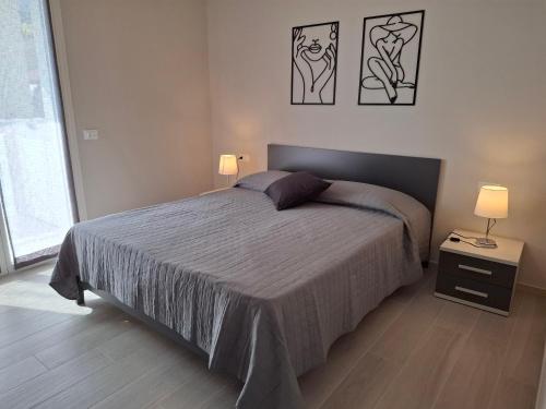 Ένα ή περισσότερα κρεβάτια σε δωμάτιο στο Nuovissimo Appartamento vista mare - seaview terrace 3