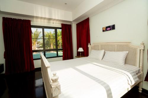 Ένα ή περισσότερα κρεβάτια σε δωμάτιο στο Laguna Luxure Private Pool Villa