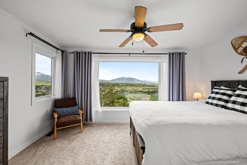 a bedroom with a bed and a ceiling fan at 838B Wapiti Dr in Fraser