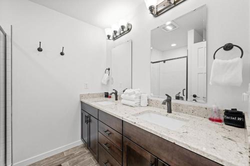 a bathroom with a sink and a large mirror at 838B Wapiti Dr in Fraser