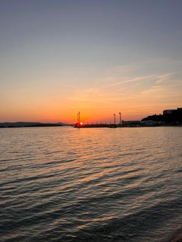 a sunset over a large body of water at Mobile Home Ana Mia in Biograd na Moru