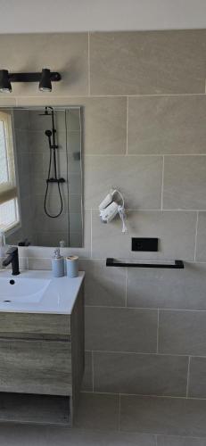 a bathroom with a sink and a tub and a mirror at Villa Can Kiko Ibiza in San Jose