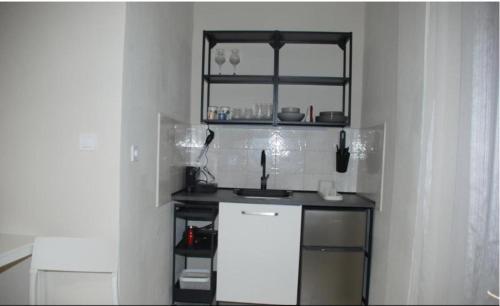 Η κουζίνα ή μικρή κουζίνα στο Gallery Rooms Ierissos