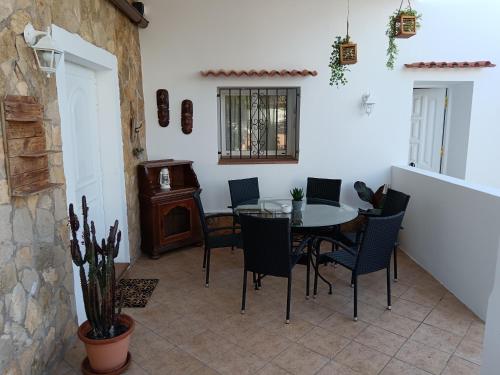 a dining room with a table and chairs at Casa Susana in Santa Eularia des Riu